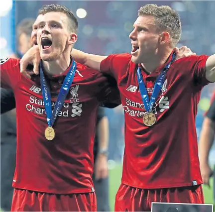  ??  ?? Andy Robertson (left) is already eyeing more trophies with Liverpool.