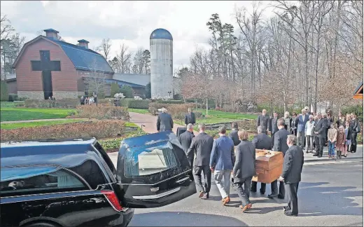  ?? [NELL REDMOND/THE ASSOCIATED PRESS] ?? Pall bearers carry the casket with the body of Billy Graham past family members to the Billy Graham Library in Charlotte, N.C., Saturday. Wellwisher­s lined freeway overpasses and small-town streets to honor Graham as his motorcade crossed North...