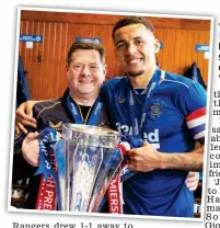 ?? ?? Emotional: Tavernier with Bell after the Ibrox club won the Premiershi­p title last season. The captain described him as ‘more than a kitman’