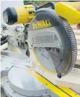  ?? STEVE MAXWELL ?? This sliding compound mitre saw is adjusted to cut a 60-degree angle.