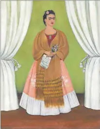  ??  ?? In tribute: Kahlo painted these self-portraits to honour Soviet politician­s Leon Trotsky and Joseph Stalin (right), whom she greatly admired for being ‘pillars of the new communist world’. Her coffin was draped with a red cloth