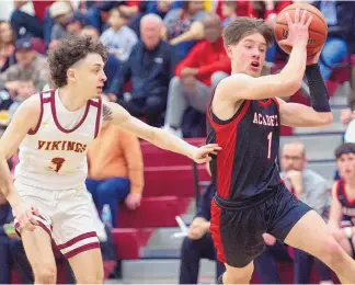  ?? CHANCEY BUSH/JOURNAL ?? Albuquerqu­e Academy senior Kellan Gehres, right, drives to the basket past Valley’s Elijah Montoya during Friday night’s game at Valley High School.