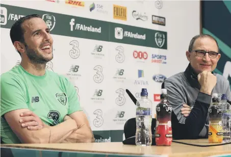  ??  ?? Republic of Ireland’s John O’Shea (left) and manager Martin O’Neill during the press conference ahead of O’Shea’s final display.