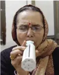  ??  ?? NEW DELHI: Indian asthma patient Sarla Bhardwaj, 50, blows into a Peak Flow Meter (PFM) as she undergoes a test at a hospital.