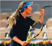  ?? THOMAS SAMSON/AFP VIA GETTY IMAGES ?? Danielle Collins reacts during her 7-5, 2-6, 6-4 win Saturday against two-time major champion Garbine Muguruza.