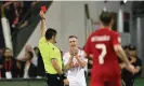  ?? Photograph: Tullio Puglia/UEFA/Getty Images ?? Morrell is shown a red card by referee Fabio Maresca in the first half.