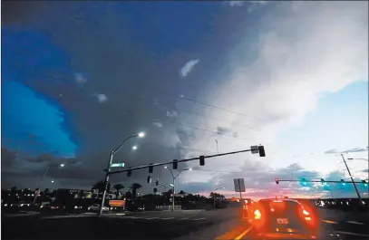  ?? Chitose Suzuki ?? Las Vegas Review-journal A storm dumps rain over Henderson on Friday. The storm, which formed and dissipated quickly, dropped 0.79 inches of rain at Green Valley Parkway and Robindale Road, meteorolog­ist Reid Wolcott said.