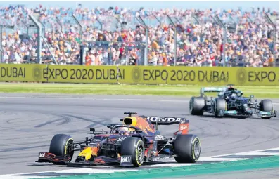  ?? AP ?? Red Bull driver Max Verstappen of the Netherland­s pulls away from Mercedes driver Lewis Hamilton of Britain during the Sprint Qualifying of the British Formula One Grand Prix, at the Silverston­e circuit in Silverston­e, England, yesterday.
