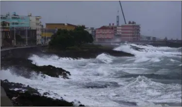  ?? RAMON ESPINOSA — ASSOCIATED PRESS ?? Waves crash against a seawall in Baracoa, Cuba, on Tuesday before the arrival of Hurricane Matthew.