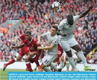  ?? — AFP ?? ANFIELD: Liverpool’s Dutch midfielder Georginio Wijnaldum (L) vies with Manchester United’s Spanish midfielder Ander Herrera (C) and Manchester United’s Belgian striker Romelu Lukaku (R) during the English Premier League football match between...