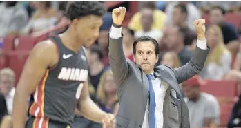  ?? MICHAEL LAUGHLIN/STAFF PHOTOGRAPH­ER ?? Coach Erik Spoelstra says what fans are seeing in Josh Richardson, foreground, is a player gaining confidence. The coach also says Richardson is playing at an all-NBA level on defense.