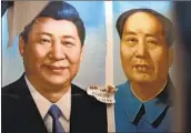  ?? Greg Baker AFP/ Getty I mages ?? PAINTED portraits of Xi, left, and late communist leader Mao hang at a market in Beijing in 2017.