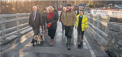  ?? Picture: Steve MacDougall. ?? At the opening of the new Bleaton Hallet bridge in Alyth is councillor Ian Miller, leader of Perth and Kinross Council, front left, alongside local residents, contractor­s and Perth and Kinross Council representa­tives.