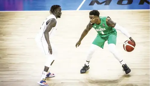  ??  ?? Nigeria’s Ike Iroegbu (r) attempts to dribble past Teny Bak Puot of South Sudan during yesterday’s 2021 Afrobasket qualifier
