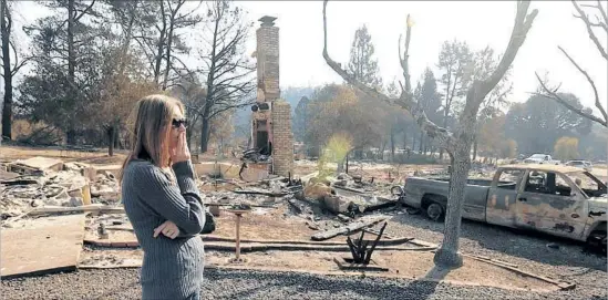  ?? Photograph­s by Genaro Molina Los Angeles Times ?? DEBBY SEARS looks over the wreckage of her parents’ home in Redwood Valley. Her parents had lived there for 30 years. About 500 homes in the valley burned.