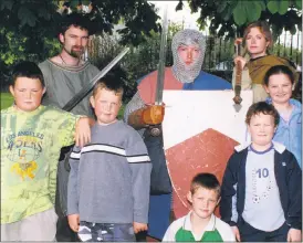  ?? ?? Combatants, Derek Gallagher, Dave Senior and Aoife Hayes, with some young people who attended the battle re-enactment held in Fermoy Town Park 21 years ago. L-r: brothers, Barry and Jamie Coughlan, Ciarán Hanley, along with Tadhg and Maria Downey.