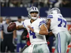  ?? AP PHOTOS ?? LEFT: In a Dec. 11 file photo, Houston Texans quarterbac­k Brock Osweiler yells on the line of scrimmage during an NFL football game against the Indianapol­is Colts, in Indianapol­is. RIGHT: In a Dec. 18 file photo, Dallas Cowboys quarterbac­k Dak Prescott...