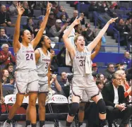  ?? Jessica Hill / Associated Press ?? Napheesa Collier (24), Megan Walker (3), Katie Lou Samuelson (33) and the rest of the Huskies will find out their NCAA tournament seed Monday.