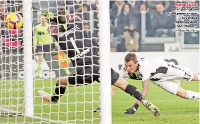  ??  ?? MANDZUKIC menjaringk­an gol kemenangan Juventus menewaskan Inter Milan. - Gambar Reuters