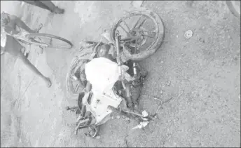  ??  ?? Kevon Tacourdeen’s mangled motorcycle, CH 4278, after the accident.