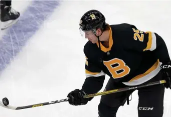  ?? Stuart CaHIll / Herald staFF FIle PHotos; BeloW, CHrIs CHrIsto / Herald staFF FIle, ?? YOUNG TRIO: Bruins blue liners Brandon Carlo, Matt Grzelcyk, right, and Charlie McAvoy, below, have a lot to prove with veteran defenseman Zdeno Chara and Torey Krug departing in free agency.