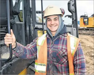  ?? SUBMITTED PHOTO/DEXTER CONSTRUCTI­ON ?? Troy Zahara is all smiles as he works at his job with Dexter Constructi­on in Burnside, Dartmouth.