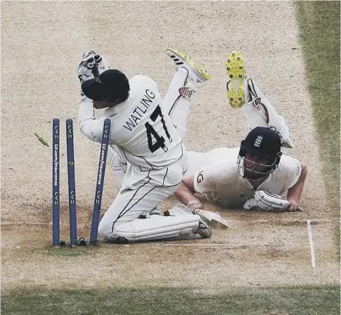  ??  ?? 0 England’s Dom Sibley dives back to his crease as New Zealand’s BJ Watling takes the bails off on the final day of the first Test