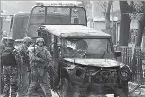  ?? MOHAMMAD ISMAIL / REUTER ?? US soldiers arrive at the site of a suicide bomb attack in Kabul on Thursday, after the bomber rammed a vehicle laden with explosives into a Turkish embassy car, killing three people.