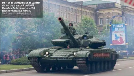  ?? (© Shuttersto­ck/popsuievyc­h) ?? Un T-64 de la République de Donetsk durant la parade du 9 mai 2017. On note la forte couverture ERA (Explosive Reactive Armor).