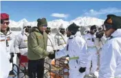  ??  ?? President Ram Nath Kovind shakes hands with soldiers posted at Siachen Base Camp on Thursday