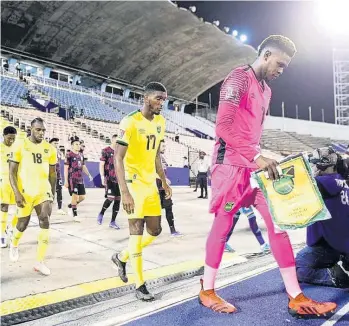  ?? FILE ?? Captain Andre Blake leads out the Jamaica team ahead of their Concacaf World Cup qualifier against Mexico at the National Stadium on Thursday, January 27.