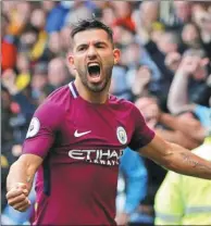  ?? DARREN STAPLES / REUTERS ?? Sergio Aguero celebrates completing his hat-trick by scoring Manchester City’s fifth goal in Saturday’s 6-0 romp over Watford in their English Premier League match at Vicarage Road, Watford.