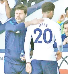  ?? — Reuters photo ?? Mauricio Pochettino (left) with Dele Alli as he is substitute­d during the English Premier League match againstWes­t BromwichAl­bion atThe Hawthorns stadium inWest Bromwich, central England in this May 5 file photo.