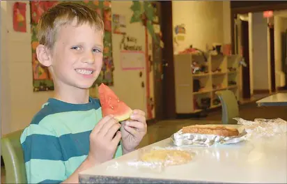  ?? ANCELENE MACKINNON/ TC MEDIA ?? Ian Mosher, a kindergart­en student at Greenfield Elementary, gets ready to eat his lunch prepared by Borrowed Kitchen, which provides students at seven Island schools with healthy, homemade food.
