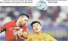  ??  ?? China’s Xiao Zhi (right) and Qatar’s Boulem Khoukhi vie for the ball during the FIFA World Cup 2018 qualifying match at the Jassim Bin Hamed Stadium in Doha. — AFP photo