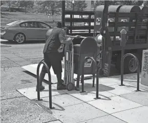  ?? BETHANY BRUNER/USA TODAY NETWORK ?? A postal worker said he was removing mailboxes in Columbus, Ohio, in May after protests. The boxes were back Aug. 21.