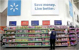  ?? [AP FILE PHOTO] ?? Walmart shares ended Tuesday down $10.67 to $94.11, its biggest single-day drop in percentage terms since Jan. 8, 1988.