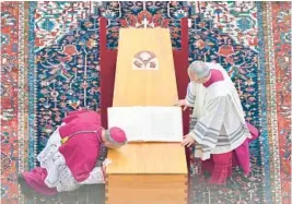  ?? VATICAN MEDIA ?? Archbishop Georg Gaenswein kisses the coffin of Pope Emeritus Benedict XVI during his funeral Thursday in St. Peter’s Square at the Vatican. Benedict, 95, died Saturday.