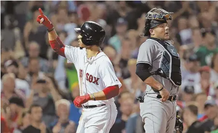  ?? STAFF PHOTO BY MATT STONE ?? SECOND CHANCE: Mookie Betts celebrates a home run during the Red Sox’ recent sweep of Austin Romine (right) and the Yankees, who potentiall­y could get 100 victories and still have to play in the AL wild card game.