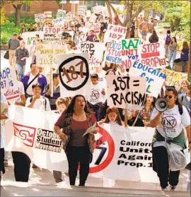  ?? Paul Morse Los Angeles Times ?? UCLA STUDENTS march on campus in October 1994 to protest Propositio­n 187, which angered millions of Latinos, turning them even more against the GOP.