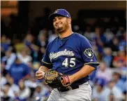  ?? HARRY HOW / GETTY IMAGES ?? Brewers right-hander Jhoulys Chacin limited the Dodgers to three hits in 5⅓ innings in Game 3 of the National League Championsh­ip Series on Monday. Chacin struck out six and walked two.