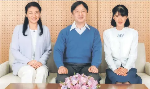  ?? — AFP photo ?? Japan’s Crown Prince Naruhito (centre) poses for a photo with Crown Princess Masako (left) and their daughter Princess Aiko at Togu Palace in Tokyo, Japan, in this handout photo released by Imperial Household Agency of Japan.