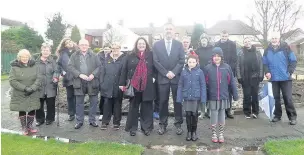  ??  ?? Clive Grunshaw at Piggy Park with Coun Clare Cleary, members of the Piggy Park Community Garden Associatio­n, plus staff and members of resource service Rockmount Northwest and St Charles’ RC School, Rishton