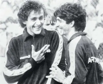  ??  ?? This file photo taken on May 15, 1984, shows Juventus’ French forward Michel Platini (left) sharing a laugh with Juventus’ Italian forward Paolo Rossi during a training session on the eve of the Winners Cup final match against Porto in Basel.