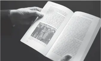  ?? DAX MELMER ?? Author Patrick Brode opens his book, Dying for a Drink, to a page with Rev. J.O.L. Spracklin’s 1920 squad of “specials,” who were tasked with catching bootlegger­s, but often sold the booze they seized.