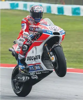  ?? Picture: EPA-EFE ?? TRICKSTER. Italian MotoGP rider Andrea Dovizioso of Ducati performs a wheelie after winning the Malaysian Grand Prix at Sepang yesterday.