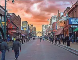  ?? JOSHUA BROWN/MEMPHIS TOURISM ?? Top places to visit in Memphis include famous Beale Street, shown at sunset, for its live music.