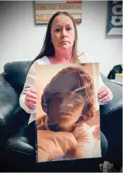  ?? Shamaya Sutton/appeal-democrat ?? Teresa Roseberry sits in the Yuba County Victim Services office in Marysville last week holding a laminated picture of her son, Cody Dymon, who was murdered in Linda in 2018.