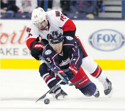 ?? PAUL VERNON/ THE CANADIAN PRESS ?? The career of Senators’ Clarke MacArthur, top, shown here battling Columbus Blue Jackets’ Cam Atkinson, might be in danger after suffering his fourth concussion in about a year-and-a-half during an Ottawa Senators Fan Fest scrimmage on Sunday.