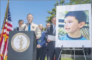  ?? MARK RIGHTMIRE — STAFF PHOTOGRAPH­ER ?? California Highway Patrol Assistant Chief Don Goodbrand speaks about the arrests of suspects Marcus Eriz and Wynne Lee in the death of Aiden Leos, in the picture on the right. The 6-year-old boy was shot and killed while on his way to kindergart­en in his mother’s car on the 55 Freeway in Orange on May 21.